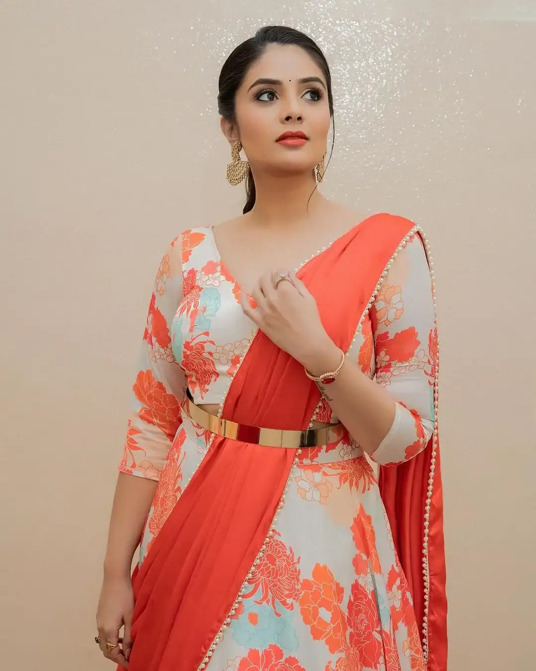 Beautiful Indian Actress Sreemukhi in Orange Lehenga Choli